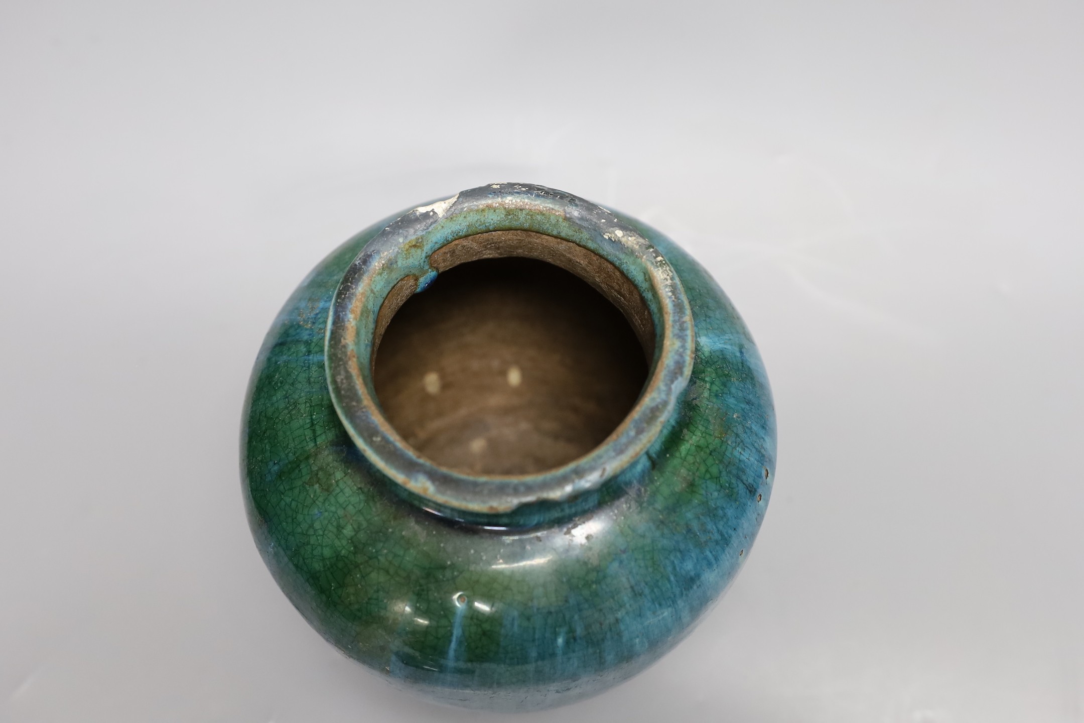 A Chinese mottle glazed terracotta jar and cover, 19th century, 24 cms high